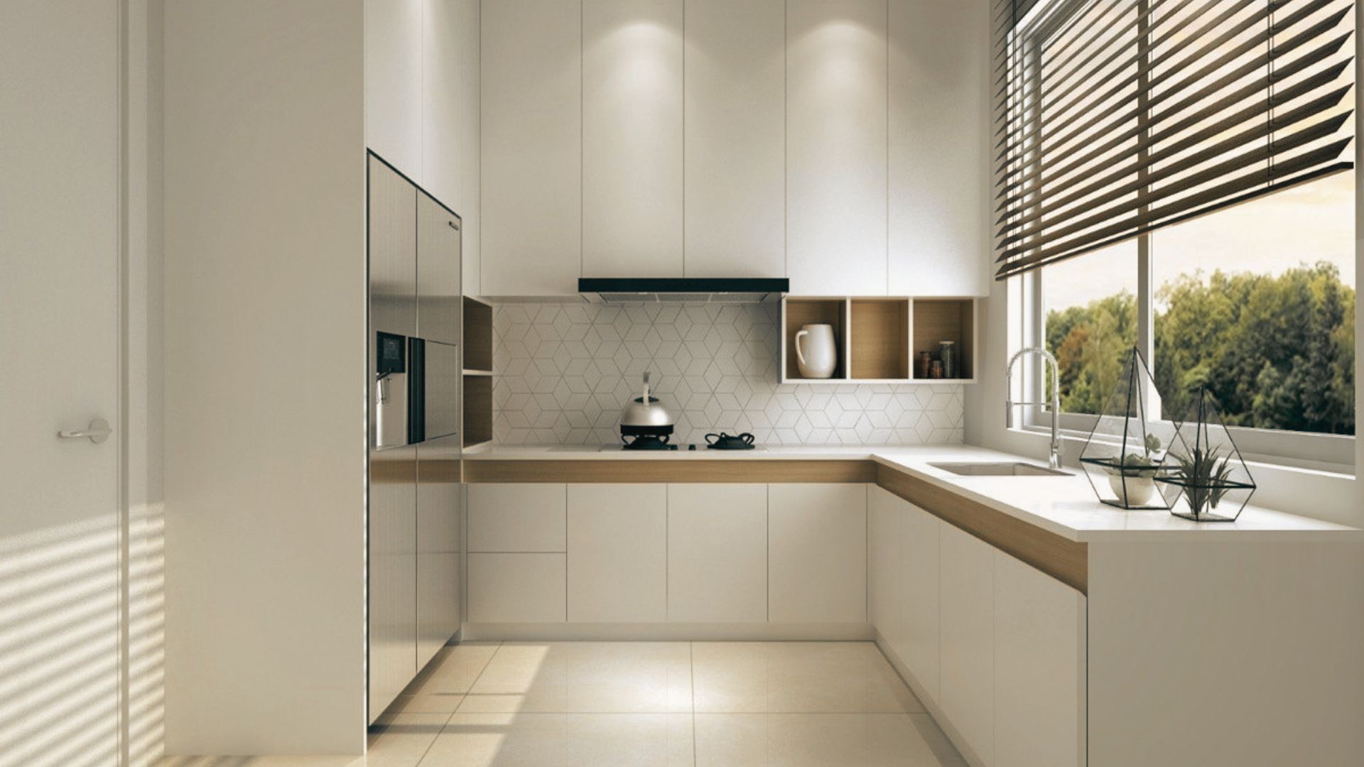 Small white kitchen with stainless steel refrigerator and range against wood flooring.