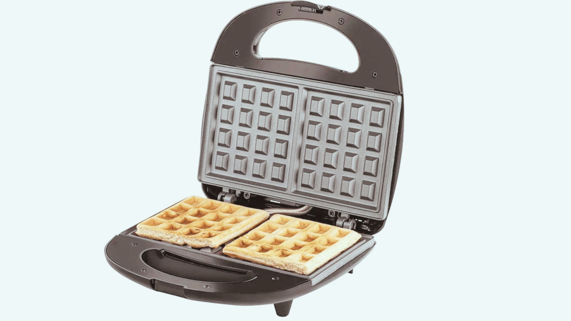 A black waffle maker with two cooked waffles on the bottom plate, displayed against a plain white background.