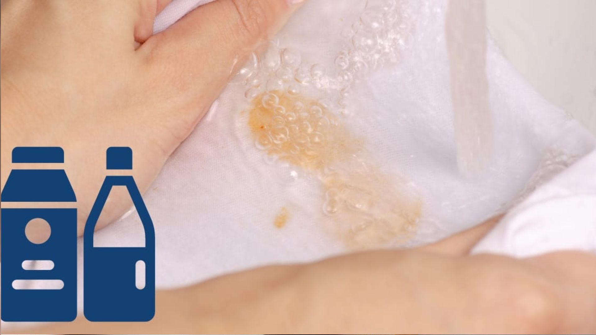 Close-up of hands washing white fabric with a brown food stain under running water, with blue detergent bottle icons on the left side.