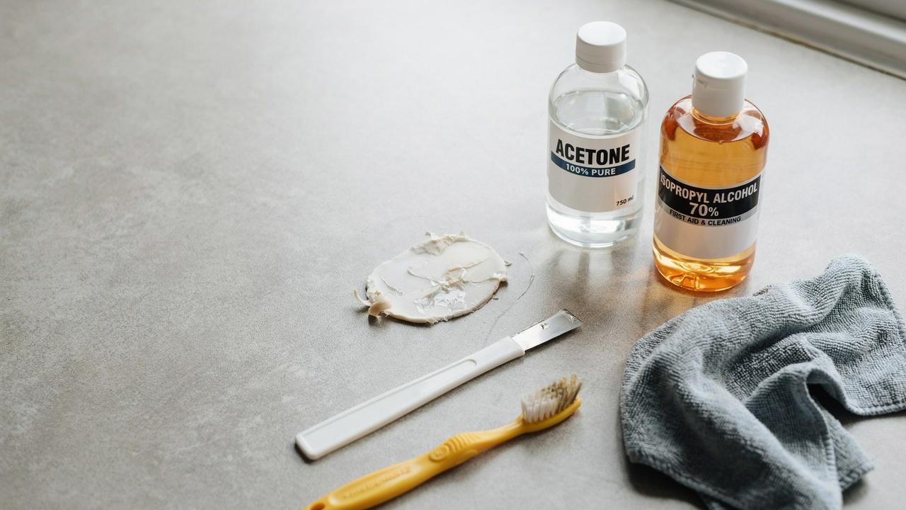 Dried super glue with tools used for safe removal.