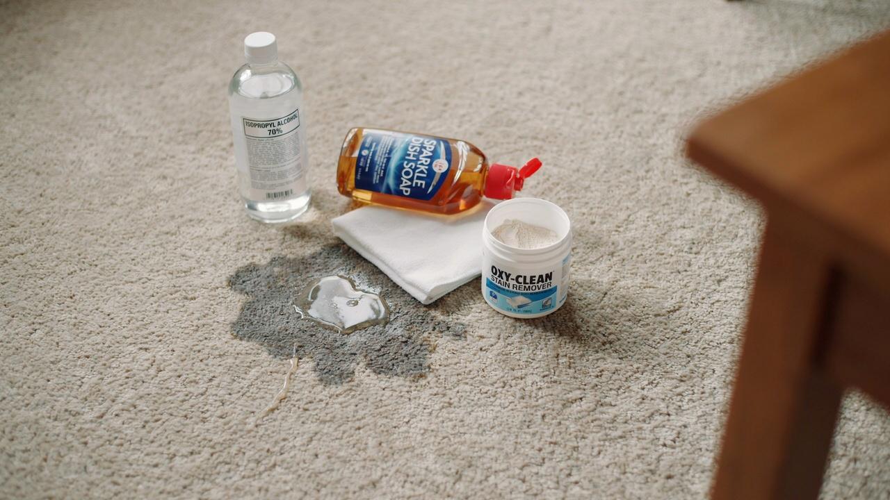 Treating leftover candle wax stain on carpet.