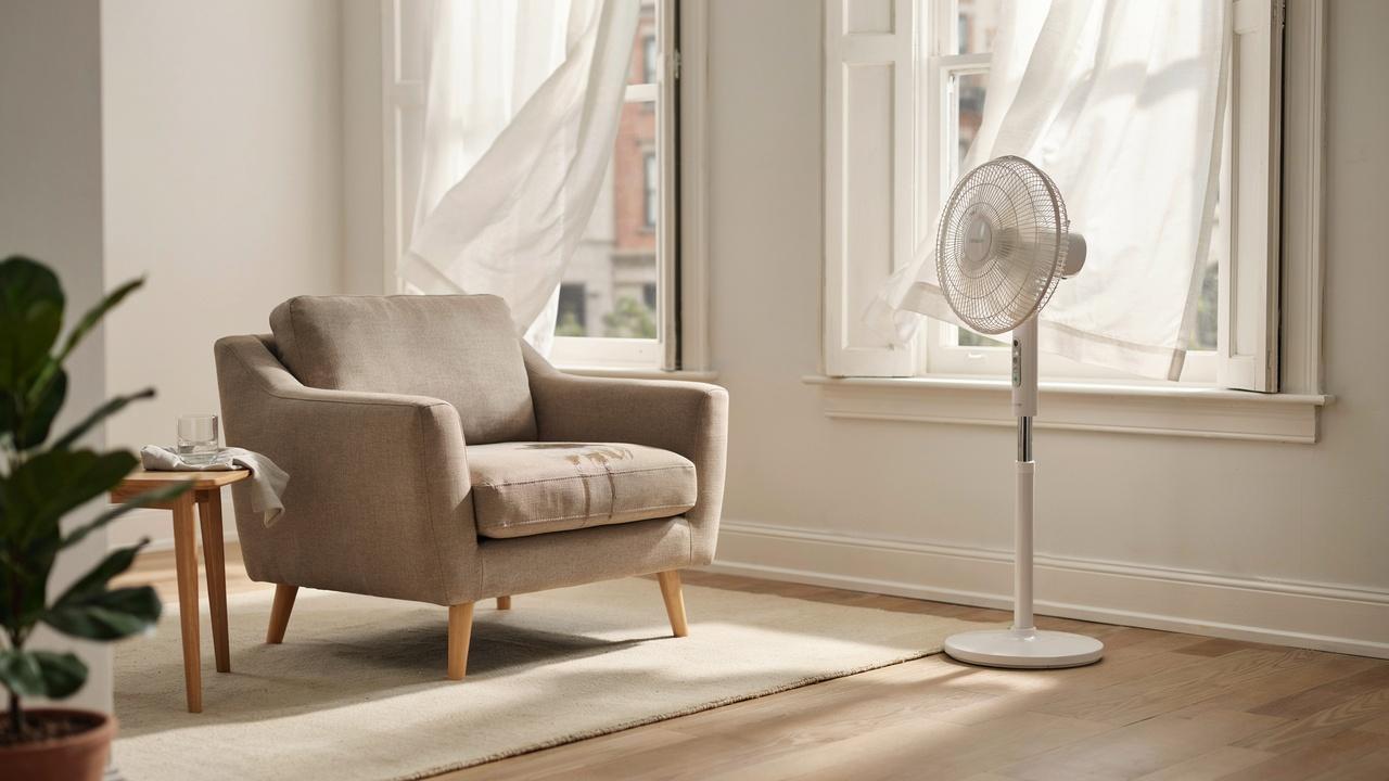 Properly drying a cloth chair after cleaning.