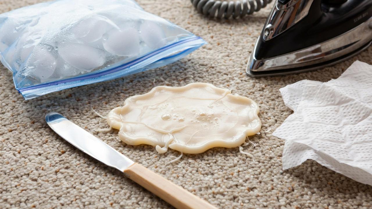 Hardened candle wax on carpet before cleaning.